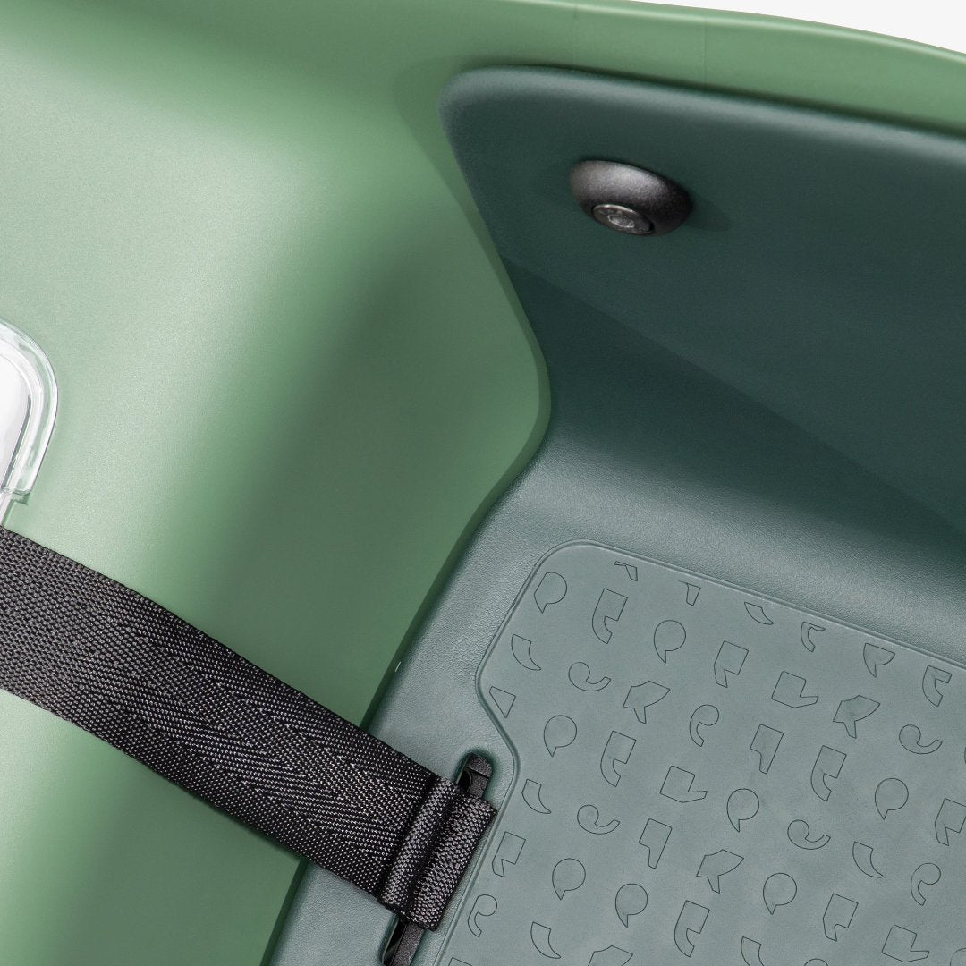 Detailed shot of the inlay of the Kvisp dog carrier in the color Forest Green with detailed dog tail pattern #color_forest-green